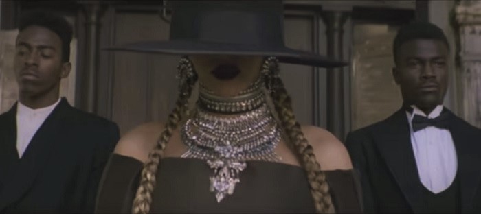 Beyonce wearing the Dylanlex "Ivy" earrings, "Hadley" choker, "Falkor II" necklace, and the "Rocky" and "RHYS" bracelets. (Photo: YouTube screenshot)